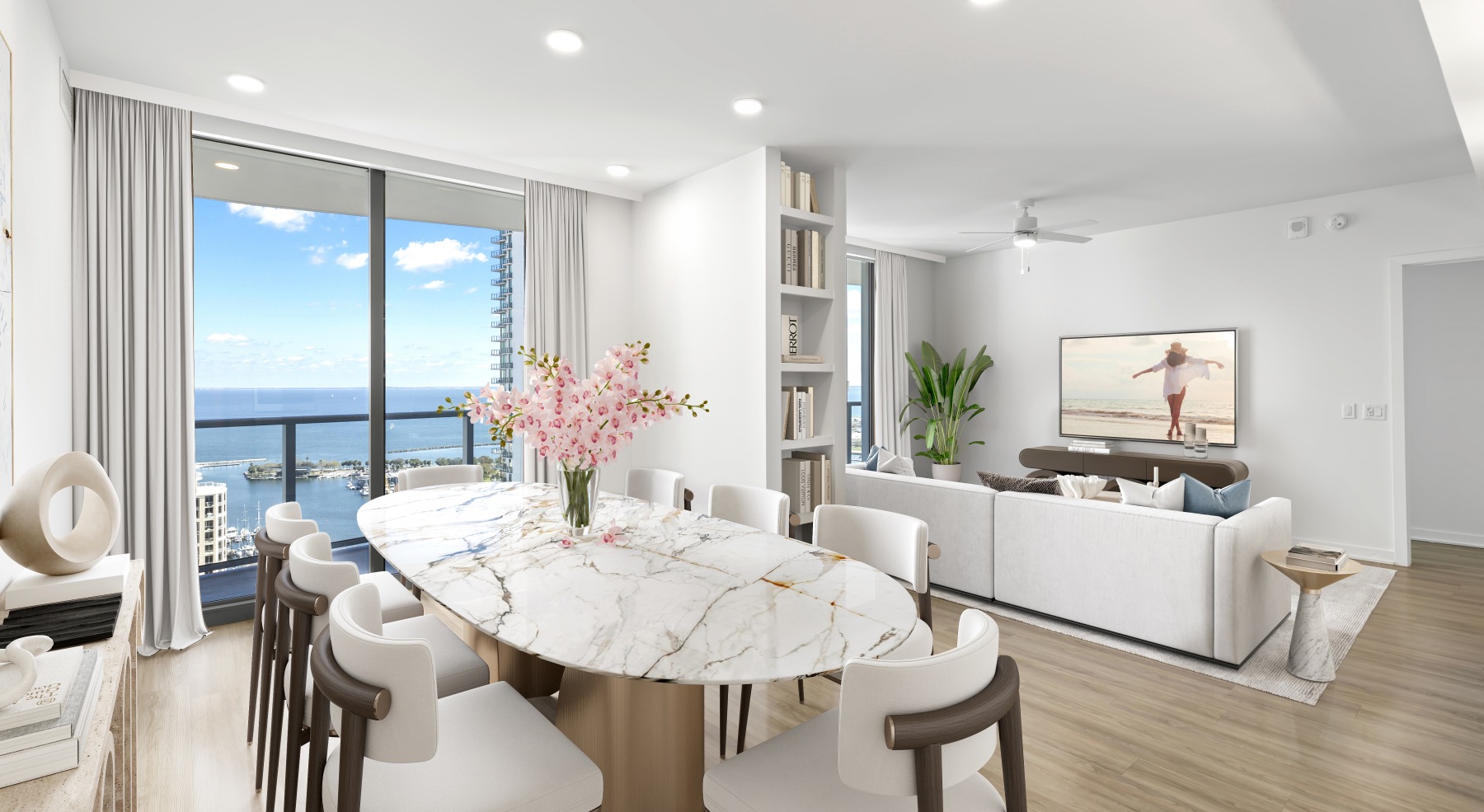 ascent st pete dining living area dining table set balcony waterfront views sofa tv wood flooring penthouse view ascent st pete dining living area dining table set balcony waterfront views sofa tv wood flooring penthouse view