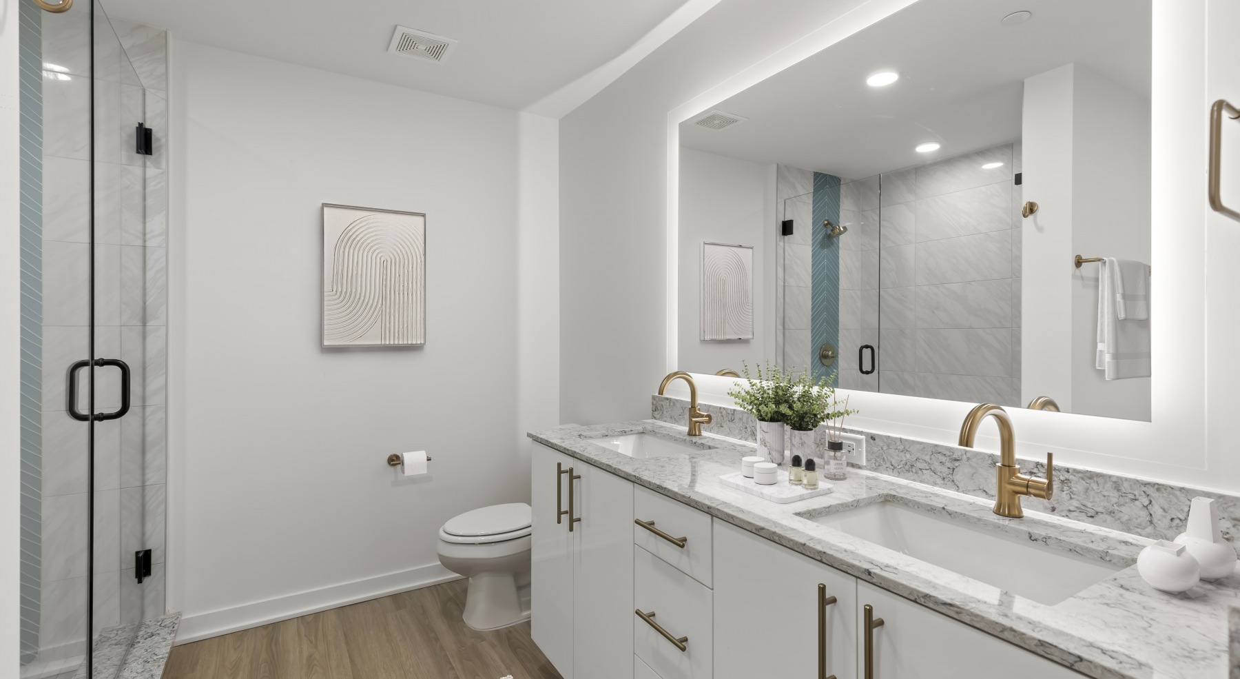 ascent st pete bathroom vanity halo lit mirror standalone shower toilet wood floors ascent st pete bathroom vanity halo lit mirror standalone shower toilet wood floors