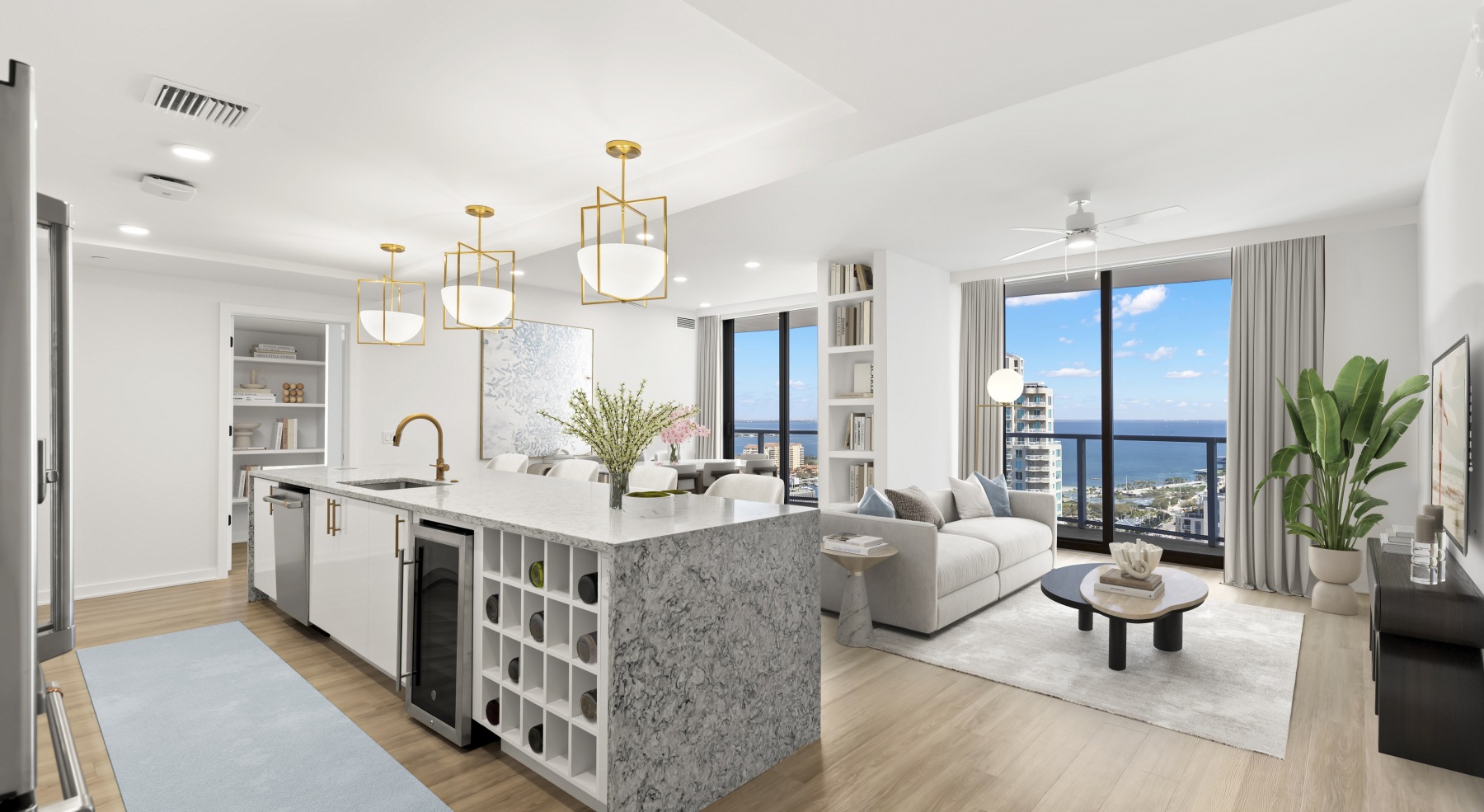 ascent st pete kitchen island barstools cabinetry fridge living area view sofa coffee table pendant lighting waterfront view penthouse balcony wood floors ascent st pete kitchen island barstools cabinetry fridge living area view sofa coffee table pendant lighting waterfront view penthouse balcony wood floors