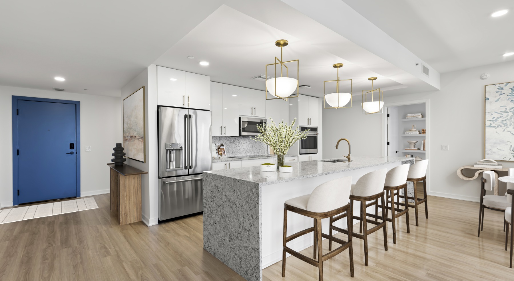 ascent st pete kitchen island barstools cabinetry fridge blue entry door wood floors ascent st pete kitchen island barstools cabinetry fridge blue entry door wood floors