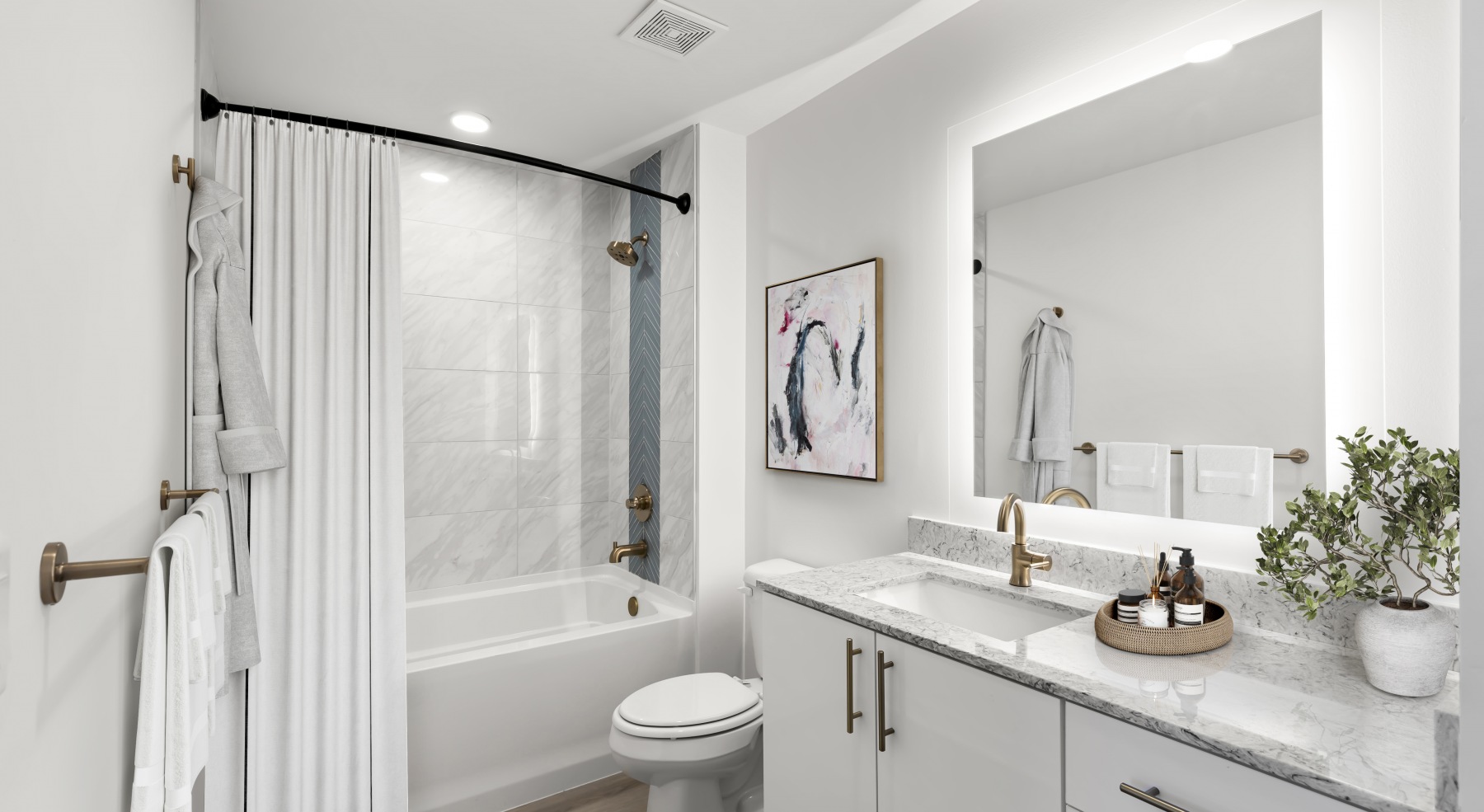 ascent st pete bathroom vanity halo lit mirror soaking tub toilet wood floors ascent st pete bathroom vanity halo lit mirror soaking tub toilet wood floors